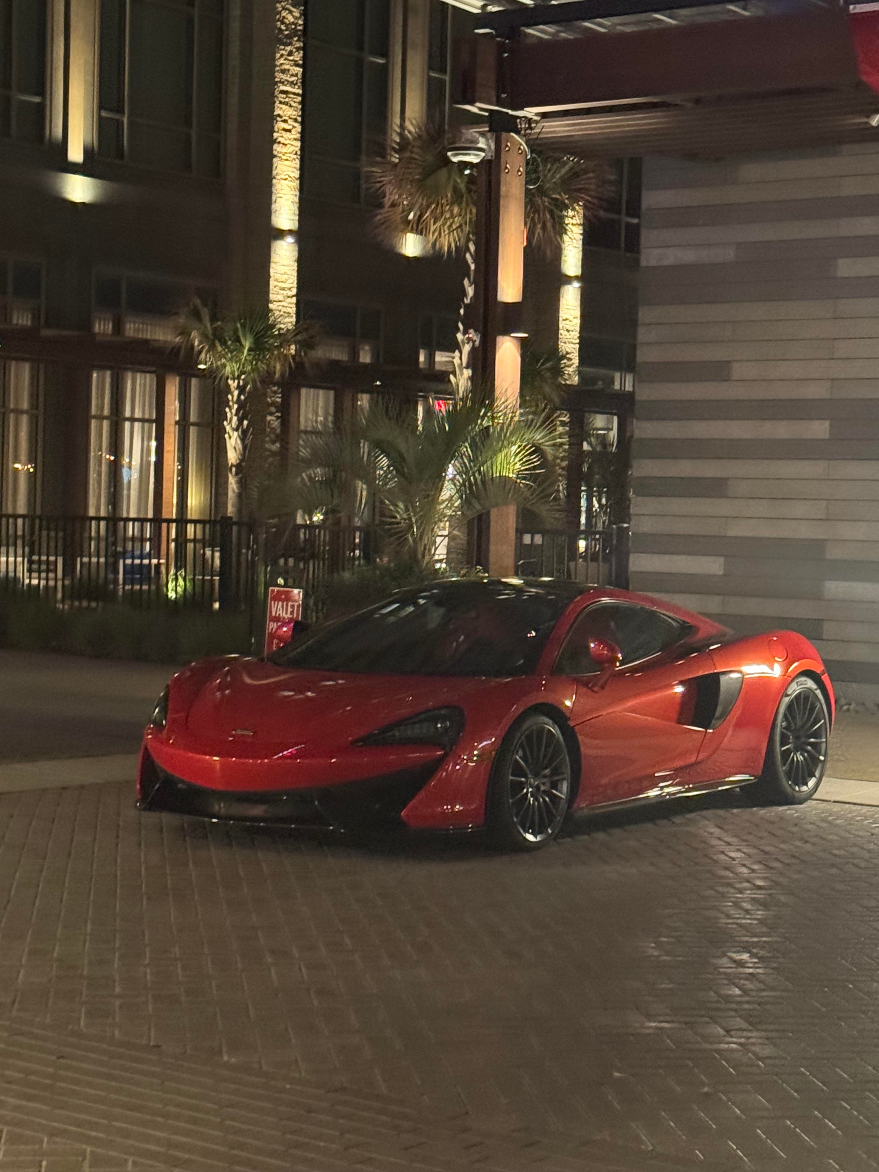 McLaren arriving at a Virginia Beach oceanfront hotel at night
